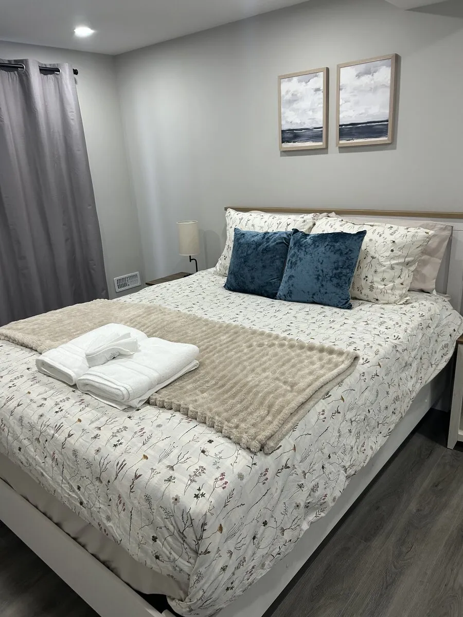 Bedroom after a deep clean with the bed made