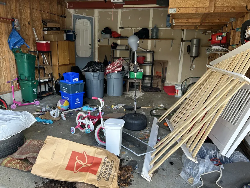 Cluttered garage before cleaning