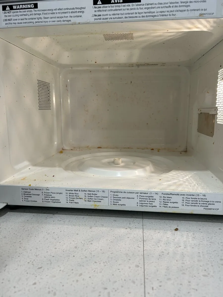 Stained microwave interior before cleaning