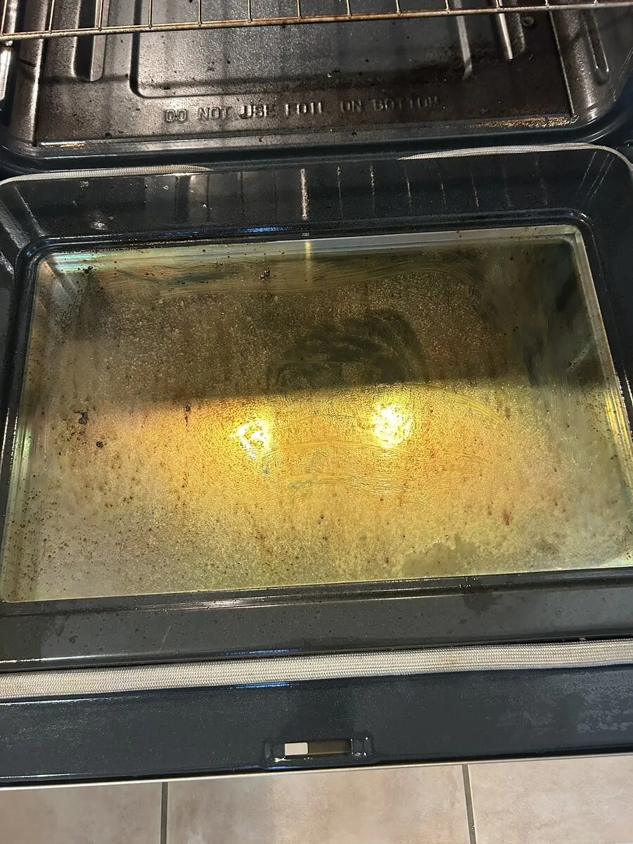 Oven interior with baked-on build-up before a deep clean