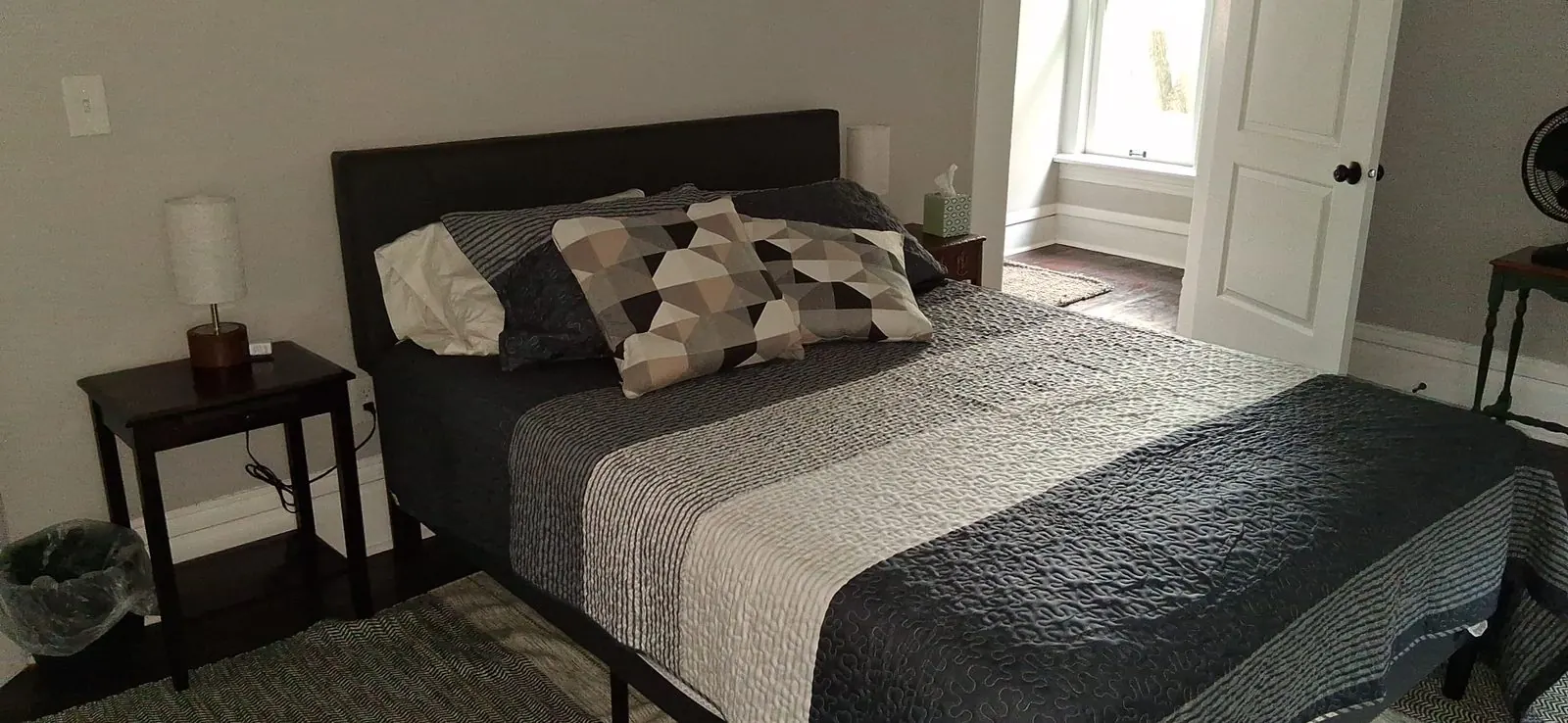 Rental bedroom with the bed made for arriving guests