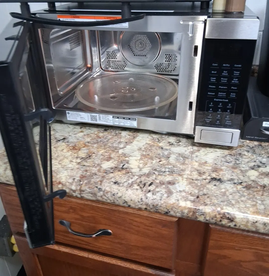 Clean office break area with counter and microwave